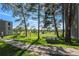 Landscaped grounds with walking path and seating area at 2525 S Dayton Way # 1109, Denver, CO 80231