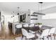 Spacious kitchen featuring an island, stainless steel appliances, and a dining area at 357 S Ogden St, Denver, CO 80209