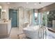Spa-like bathroom featuring a large soaking tub, walk-in shower, and modern fixtures at 17575 E Kettle Pl, Centennial, CO 80016