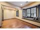 Bright bedroom with hardwood floors and a window seat at 17575 E Kettle Pl, Centennial, CO 80016