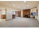 Finished basement with a fireplace, wet bar, and built-in shelving at 17575 E Kettle Pl, Centennial, CO 80016