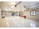 Spacious garage with car lift and abundant storage at 17575 E Kettle Pl, Centennial, CO 80016