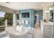 Luxurious bathroom with a freestanding tub, dual vanities, and views at 17575 E Kettle Pl, Centennial, CO 80016