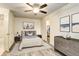 Bedroom with ensuite bathroom and ceiling fan at 1820 Newland Ct # 213, Lakewood, CO 80214