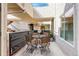 Private patio with table and chairs, perfect for outdoor dining at 1820 Newland Ct # 213, Lakewood, CO 80214