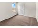 Simple bedroom with a window and a door at 7211 Dolores Ave, Frederick, CO 80530