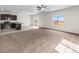 Spacious living room with kitchen and sliding door access at 7211 Dolores Ave, Frederick, CO 80530