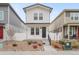 Two-story house with white siding, small front yard, and white picket fence at 4943 N Yampa St, Denver, CO 80249