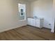 Simple wet bar with white cabinets and a sink at 12909 Range St, Firestone, CO 80504