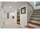 Basement stairs with wood treads and neutral-colored walls at 1529 Holly, Denver, CO 80220