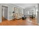 Living room with hardwood floors, a sofa, and chairs at 1529 Holly, Denver, CO 80220