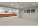 Spacious finished basement with bar area and built-in shelving at 1529 Holly, Denver, CO 80220