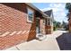 Brick home exterior with walkway and landscaping at 1529 Holly, Denver, CO 80220