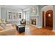 Living room with hardwood floors, fireplace, and seating at 1529 Holly, Denver, CO 80220