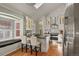 Modern kitchen with white cabinets, stainless steel appliances, and breakfast bar at 1529 Holly, Denver, CO 80220