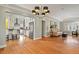 Open concept dining room with hardwood floors and views into the kitchen at 1529 Holly, Denver, CO 80220
