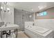 Basement bathroom with soaking tub and walk-in shower at 1529 Holly, Denver, CO 80220