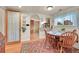 Cozy dining area with wood table and chairs, and access to the kitchen at 940 Orion St, Golden, CO 80401