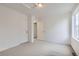 Bedroom with gray carpet and access to a bathroom at 4703 Thistle Dr, Brighton, CO 80601