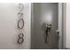 Close up of apartment door 208 at 1265 Race St # 208, Denver, CO 80206