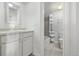 Clean bathroom with a tub, shower, and white vanity at 1265 Race St # 208, Denver, CO 80206