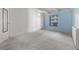 Spacious bedroom with light gray carpeting and ample natural light at 1265 Race St # 208, Denver, CO 80206