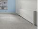 Bright bedroom with a large window and wall-mounted heater at 1265 Race St # 208, Denver, CO 80206