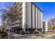 Building exterior showcasing ample parking and landscaping at 1265 Race St # 208, Denver, CO 80206