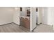 Kitchen with wood cabinets and breakfast bar at 1265 Race St # 208, Denver, CO 80206