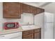 Clean kitchen with white appliances and modern sink at 1265 Race St # 208, Denver, CO 80206