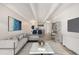 Virtually staged living room with modern furniture and open floor plan at 1265 Race St # 208, Denver, CO 80206