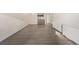 Living room with hardwood floors and open kitchen view at 1265 Race St # 208, Denver, CO 80206
