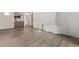 Living room with hardwood floors and kitchen bar at 1265 Race St # 208, Denver, CO 80206