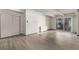 Living room with hardwood floors and sliding glass door to balcony at 1265 Race St # 208, Denver, CO 80206