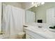 Clean bathroom with a shower/tub combo and white vanity at 16941 E Chenango Ave # C, Aurora, CO 80015