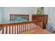 Bedroom featuring a wooden bed frame and ample closet space at 16941 E Chenango Ave # C, Aurora, CO 80015