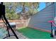 Private deck with swing, artificial turf and storage at 16941 E Chenango Ave # C, Aurora, CO 80015