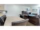 Dining area with dark leather chairs and view of living room at 16941 E Chenango Ave # C, Aurora, CO 80015