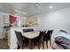 Dining area with dark chairs and open view to living room at 16941 E Chenango Ave # C, Aurora, CO 80015