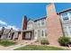 Two-story townhouse exterior with brick and gray siding at 16941 E Chenango Ave # C, Aurora, CO 80015