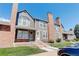 Townhouse exterior, brick and gray siding, front walkway at 16941 E Chenango Ave # C, Aurora, CO 80015