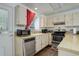 Galley kitchen with stainless steel appliances and light cabinets at 16941 E Chenango Ave # C, Aurora, CO 80015