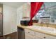 Kitchen area with double sink and stainless steel dishwasher at 16941 E Chenango Ave # C, Aurora, CO 80015