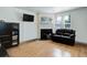 Spacious living room with hardwood floors and a corner fireplace at 16941 E Chenango Ave # C, Aurora, CO 80015