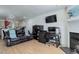 Living room features hardwood floors, a fireplace, and ample natural light at 16941 E Chenango Ave # C, Aurora, CO 80015