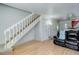 Clean and bright staircase leading to the upper level of the home at 16941 E Chenango Ave # C, Aurora, CO 80015