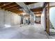 Unfinished basement area with laundry hookups and utility space at 2617 E Egbert St, Brighton, CO 80601