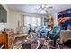 Spacious bedroom with a Broncos-themed bed and exercise bike at 2617 E Egbert St, Brighton, CO 80601