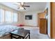 Primary bedroom with a large TV and walk-in closet at 2617 E Egbert St, Brighton, CO 80601