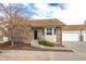 Brick front exterior of charming ranch-style home with attached garage at 2617 E Egbert St, Brighton, CO 80601